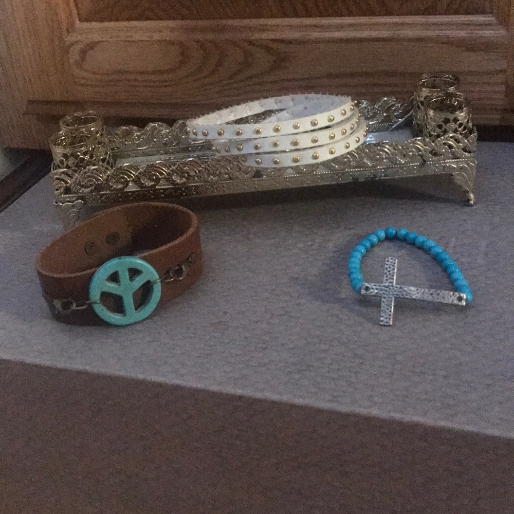Lot of bracelets, peace, cross, and wrap around